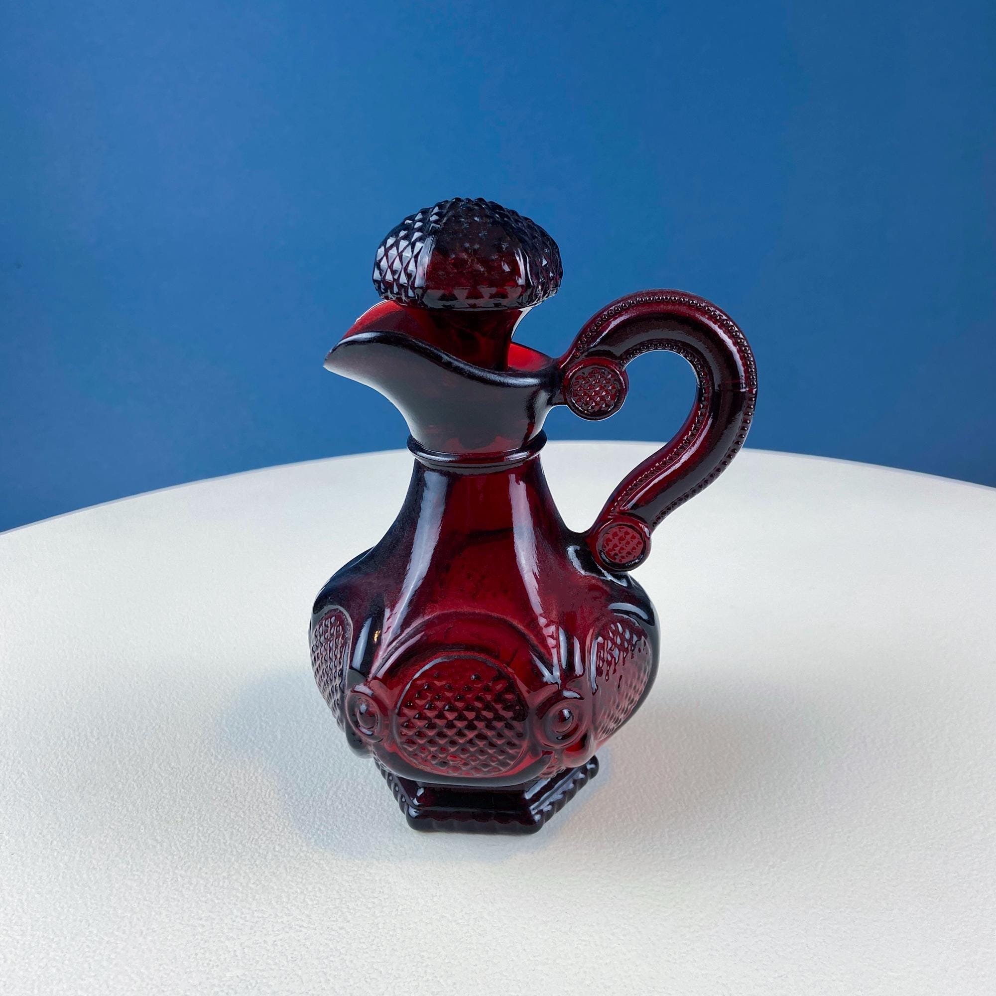 Vintage Ruby Red Avon Cape Cod Oil Vinegar Bottle with Stopper. Pressed Glass Roman Rosette Pattern. Table Dining Room Decor. Collectibles.